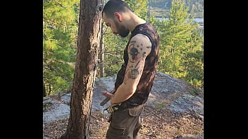 Hairy Tattooed Stud Jerking Off In The Woods.